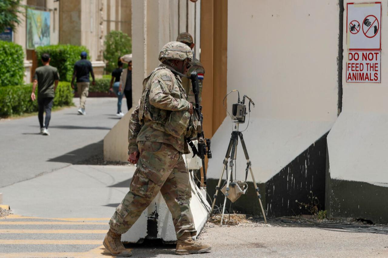 US and French soldiers stand guard at Union III Camp in the Green Zone of the Iraqi capital Baghdad. (AFP Photo)