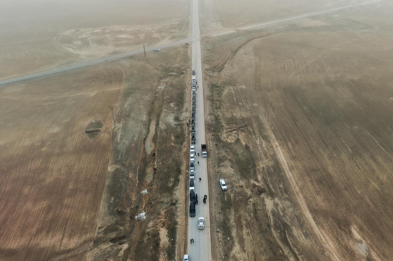 An aerial view shows a Syrian government forces military convoy driving along a road in the countryside near the northeastern Syrian city of Hasakah, Feb. 2, 2026. (AFP Photo)