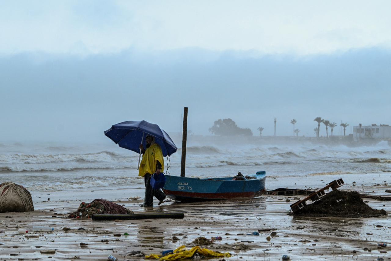 A fisherman secures his small fishing boat in La Goulette, near the capital Tunis, on January 20, 2026. (AFP Photo)