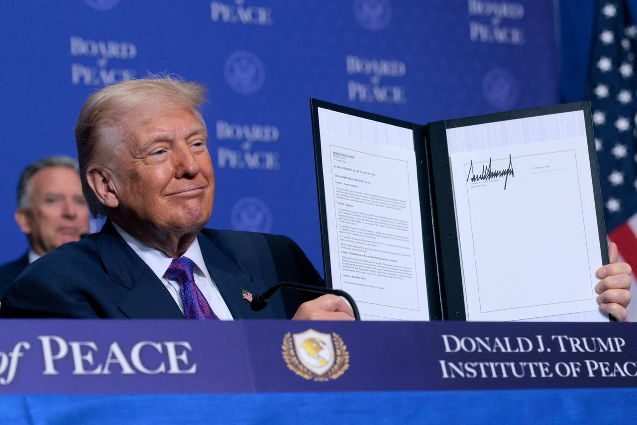 U.S. President Donald Trump signs a Memorandum of Understanding during the inaugural meeting of the Board of Peace at the Donald J. Trump Institute of Peace in Washington, DC on February 19, 2026. (AFP Photo)