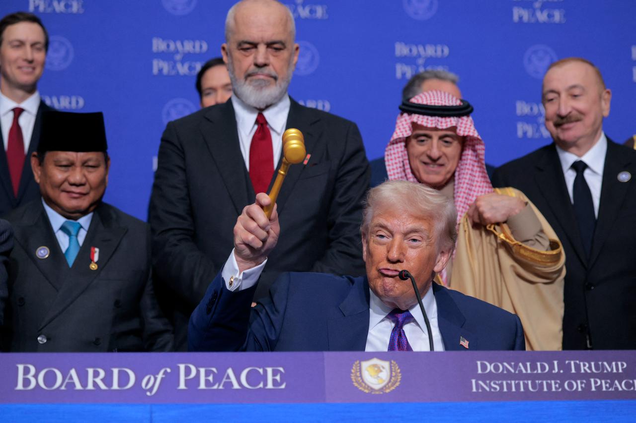 U.S. President Donald Trump gavels the inaugural meeting of the Board of Peace to a close at the Donald J. Trump Institute of Peace in Washington, DC on February 19, 2026. (AFP Photo)