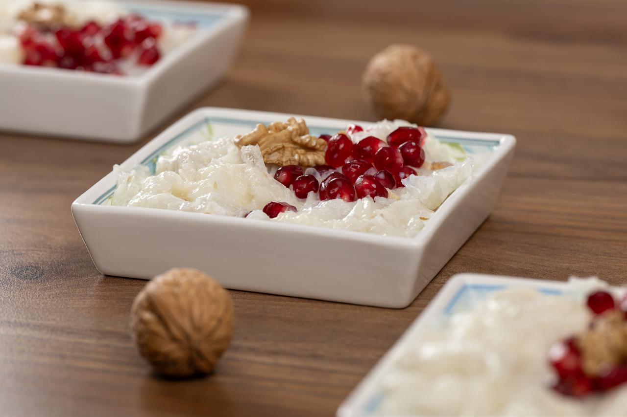 Gullac, one of the most beloved desserts of the holy month of Ramadan for Muslims, decorated with walnuts and pomegranate seeds, is seen in Ankara, Türkiye, Feb. 17, 2026. (AA Photo)