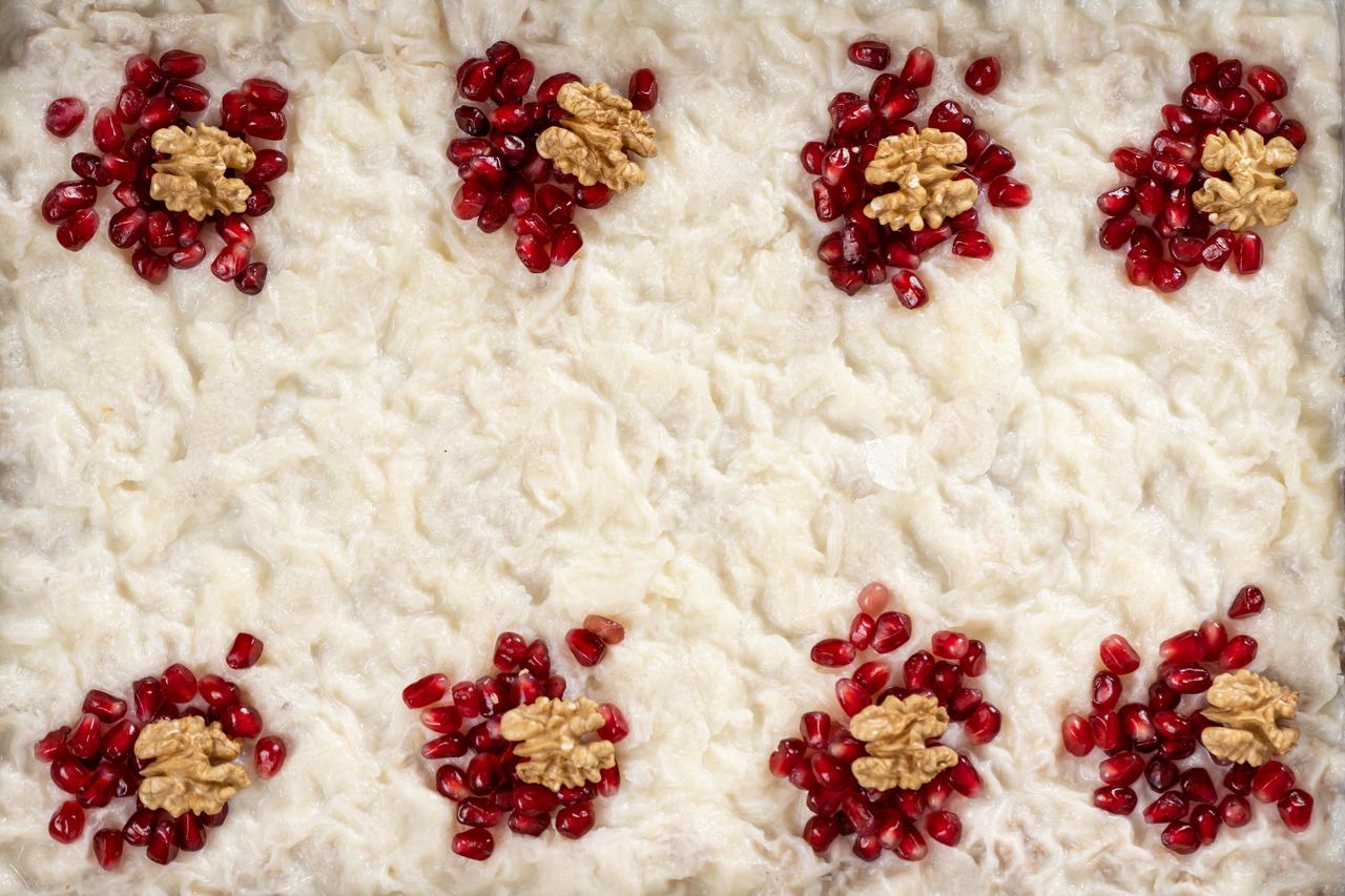Gullac, one of the most beloved desserts of the holy month of Ramadan for Muslims, decorated with walnuts and pomegranate seeds, is seen in Ankara, Türkiye, Feb. 17, 2026. (AA Photo)