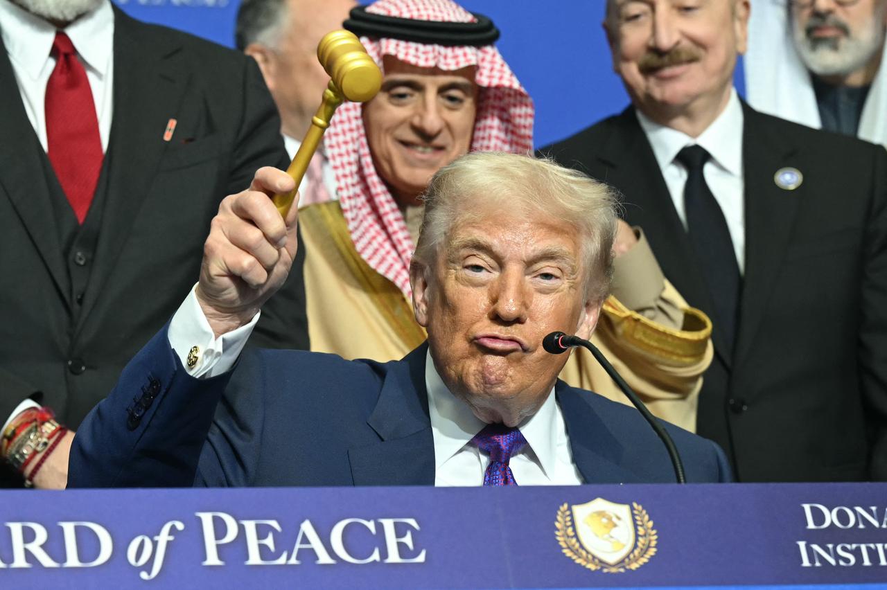 US President Donald Trump holds a gavel during a signing ceremony at the inaugural meeting of the "Board of Peace" at the US Institute of Peace in Washington, DC, on February 19, 2026. (AFP Photo)