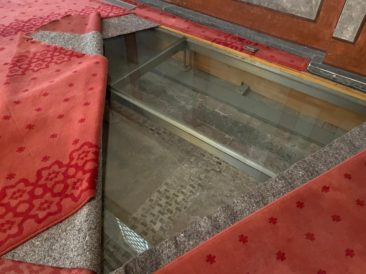 A glass-covered section of flooring inside Molla Zeyrek Mosque reveals historical layers preserved beneath the prayer hall in Istanbul, Türkiye, Feb. 17, 2026. (Photo by Koray Erdogan/Türkiye Today)