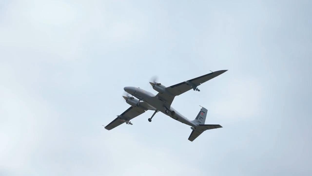 A photo of Bayraktar Akinci UCAV, carrying EREN jet-powered loitering munition during a air-to-air firing test. (Photo via X/@BaykarTech)