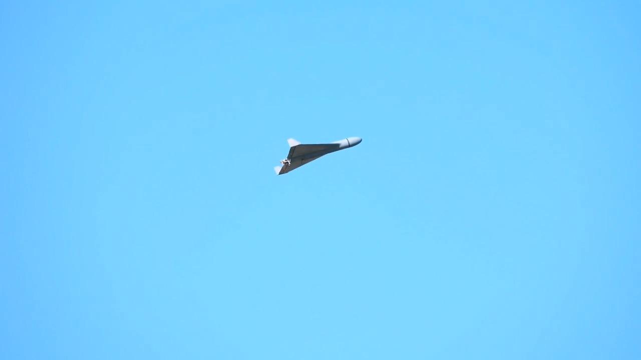 A Shahed-type kamikaze UAVs over the Black Sea during EREN high-speed loitering munition's testing from Bayraktar Akinci UCAV. (Photo via X/@BaykarTech)