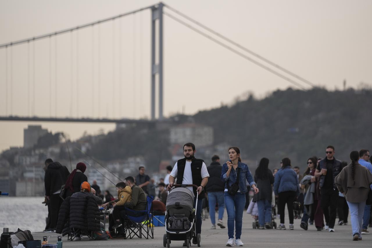 People spend time along the Emirgan coastlines after temperatures rose to as high as 23 degrees Celsius, following a prolonged period of cold weather in Istanbul, Türkiye on Feb. 15, 2026. (AA Photo)
