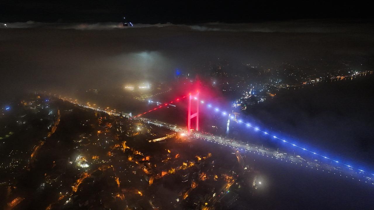 An aerial view of the fog blankets the Fatih Sultan Mehmet Bridge, Bosphorus and surrounding area in the evening hours in Istanbul, Türkiye on February 08, 2026. (AA Photo)