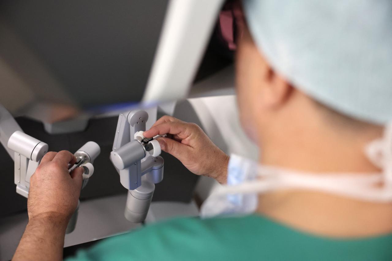 Surgeon Sylvain Ducrocq operates with surgical robot Da Vinci before a radical cystectomy at the Ajaccio Hospital, April 3, 2025 on French Mediterranean island of Corsica. (AFP Photo)