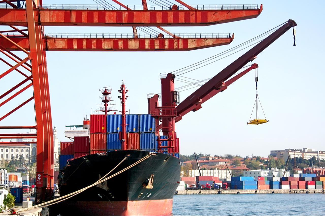 A cargo vessel is loaded with containers at a port terminal in Istanbul, Türkiye. (Adobe Stock Photo)