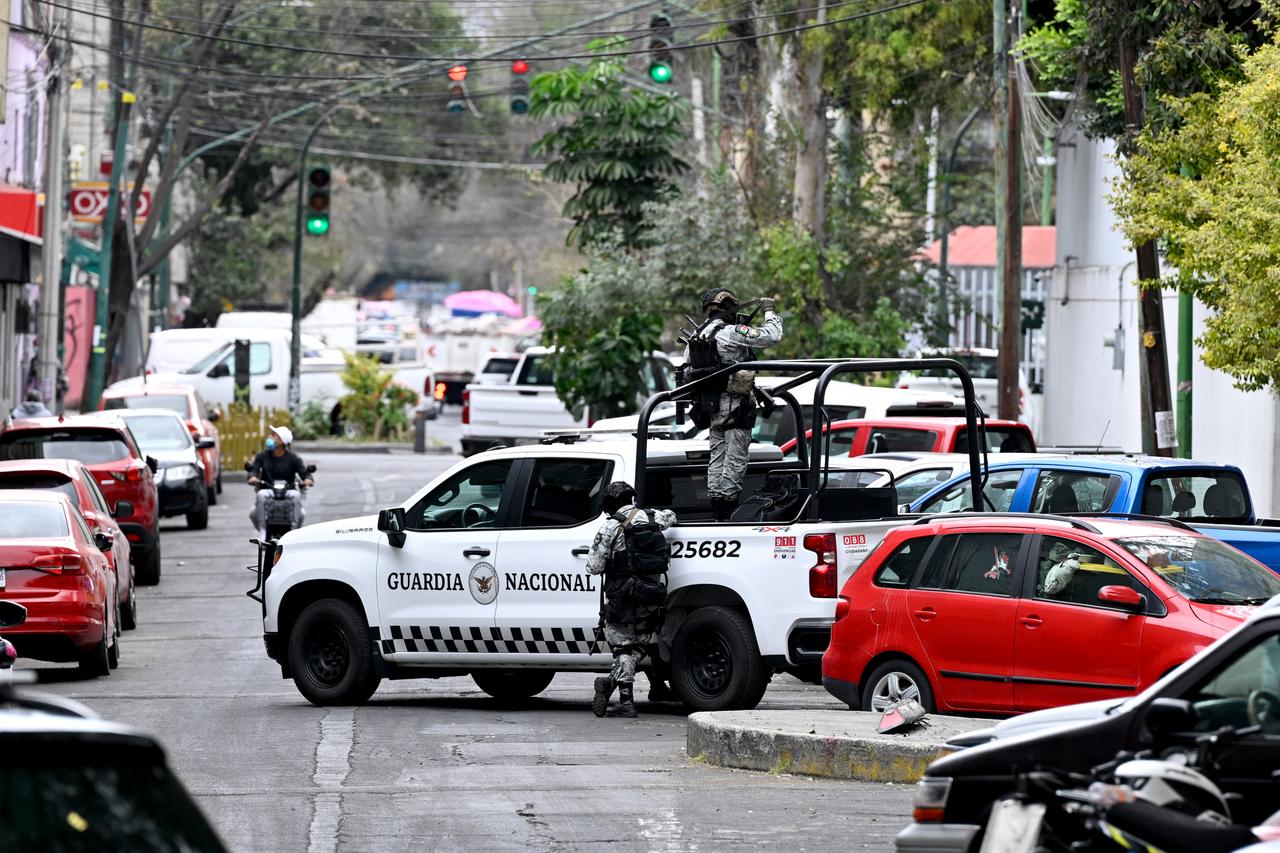 Mexican National Guard special forces guard outside the Specialized Prosecutor's Office for Organized Crime (FEMDO) headquarters in Mexico City on February 22, 2026 (AFP Photo)