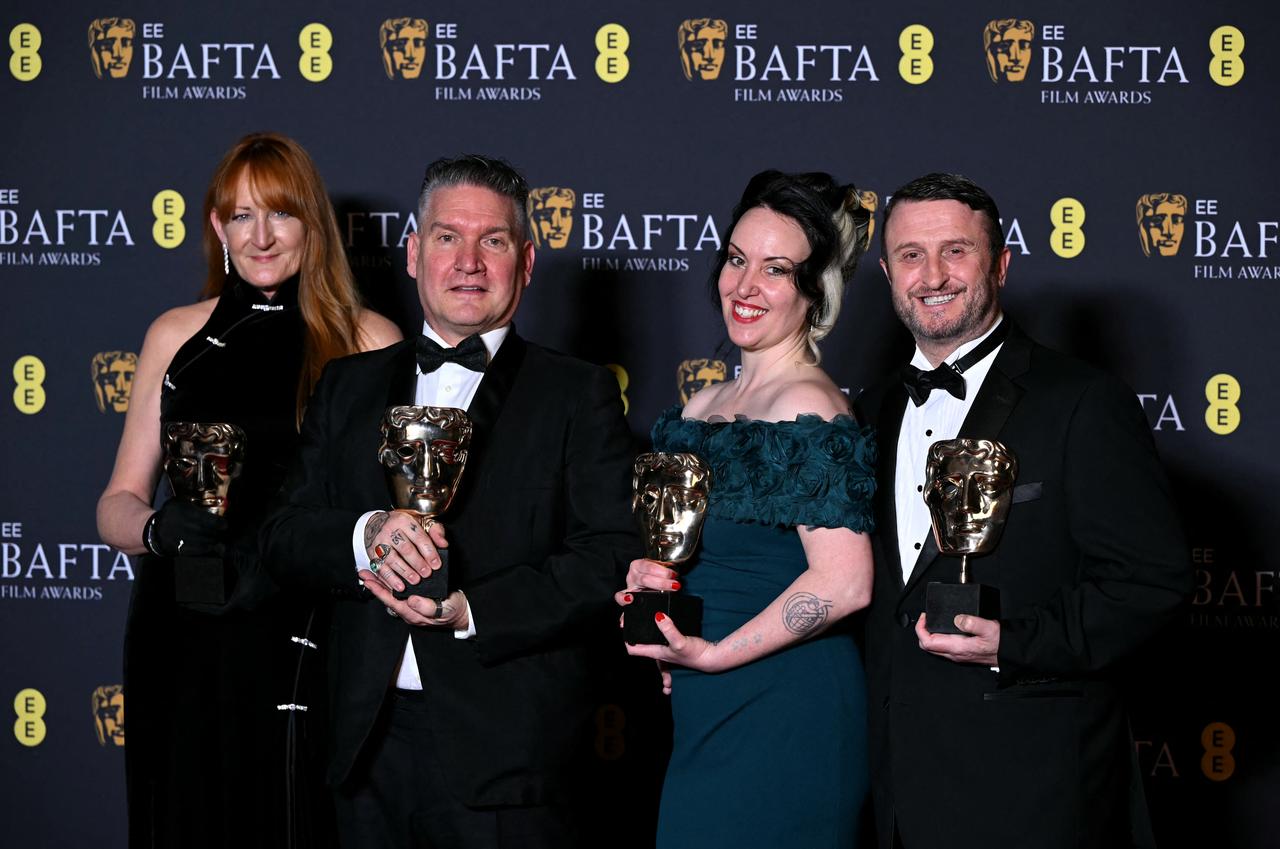 Make up artists Jordan Samuel, Cliona Furey, Mike Hill and Prosthetics Supervisor Megan Many pose with the award for Best make up and hair for "Frankenstein" during the BAFTA British Academy Film Awards ceremony at the Royal Festival Hall, Southbank Centre, in London, UK, Feb. 22, 2026. (AFP Photo)