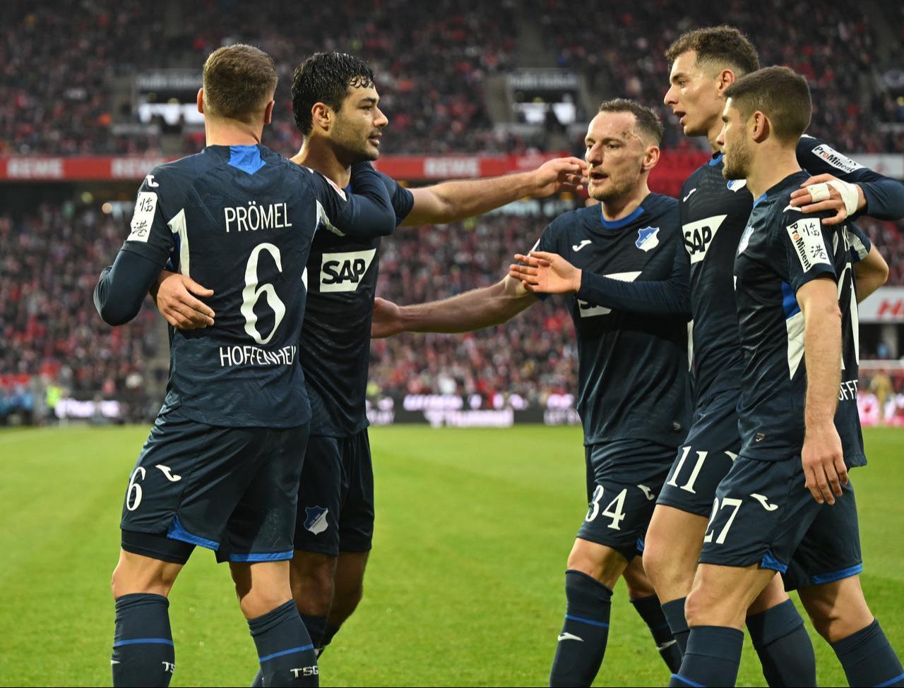 Hoffenheim's Turkish defender #05 Ozan Kabak (2nd L) celebrates his 1-1 with team mates during the German first division Bundesliga football match 1 FC Cologne v TSG 1899 Hoffenheim in Cologne, western Germany, February 21, 2026. (AFP Photo)
