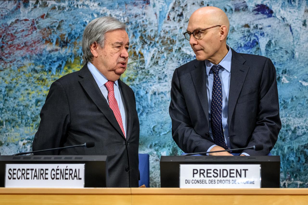 UN Secretary-General Antonio Guterres (L) and UN High Commissioner for Human Rights Volker Turk stand at the opening of the 61st session of the UN Human Rights Council at the United Nations office in Geneva on Feb. 23, 2026.