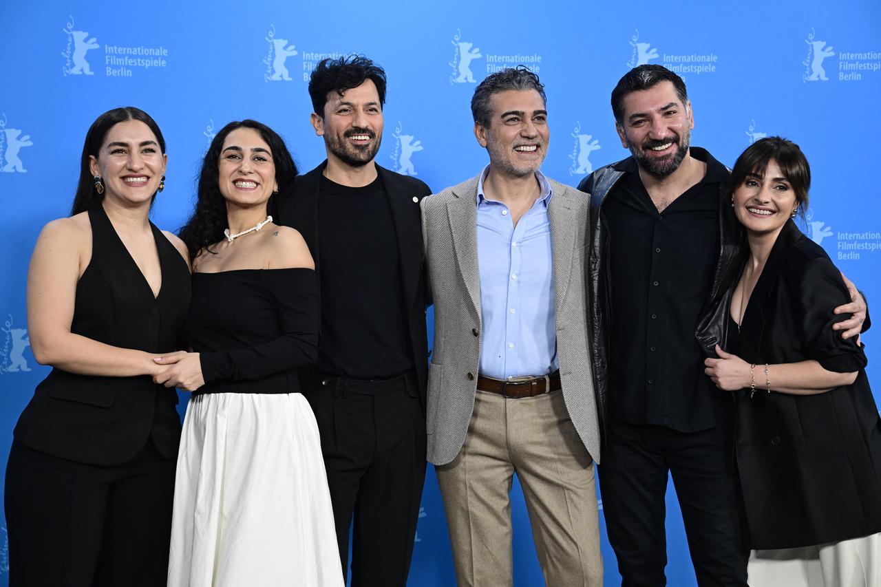 Naz Goktan, Hicran Demir, Feyyaz Duman, Caner Cindoruk, Berkay Ates and TOzlem Tas pose during a photo call for the film "Kurtulus" (Salvation), in Berlin, Germany, February 15, 2026. (AFP Photo)