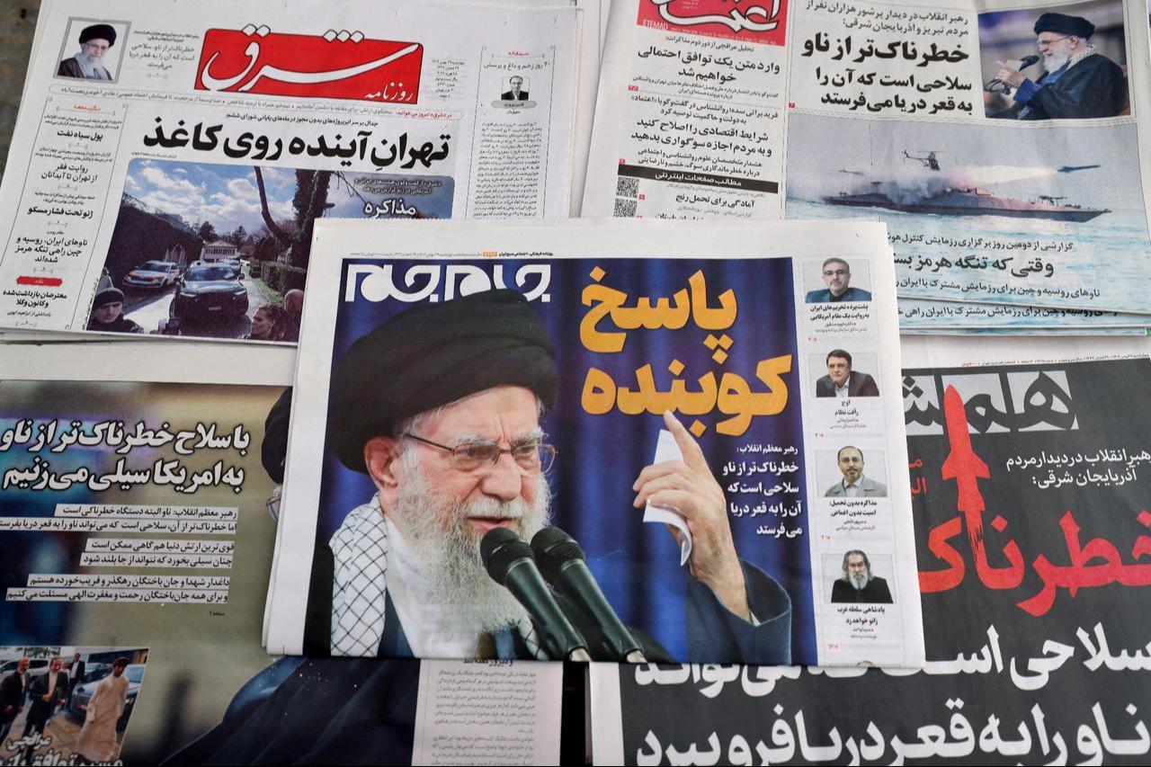 Daily Iranian newspapers are fronted with the image of Iran's Supreme Leader Ayatollah Ali Khamenei and other headlines, displayed at a kiosk in Tehran, Iran on February 18, 2026. (AFP Photo)