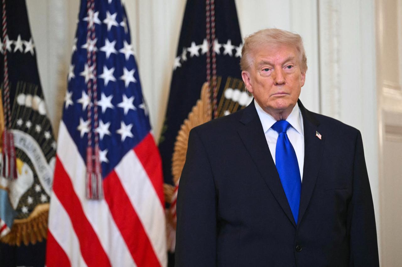 US President Donald Trump looks on during the Angel Families Remembrance Ceremony in the East Room of the White House in Washington, DC, Feb. 23, 2026. (AFP Photo)