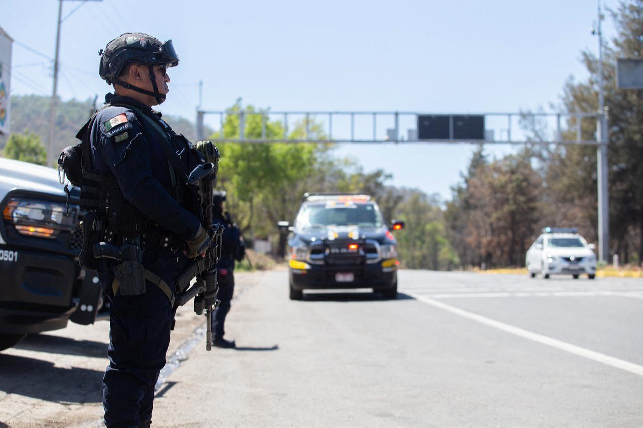 Police officers conduct a security checkpoint on the Morelia–Patzcuaro Highway to prevent vehicle fires and road blockades in Michoacan state, Mexico, Feb. 23, 2026. (AFP Photo)