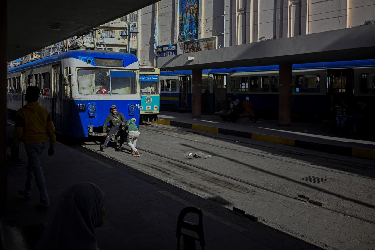 Young people walk and play along the tram tracks in Alexandria’s coastal area. Eygpt, February 18, 2026. (AFP Photo)