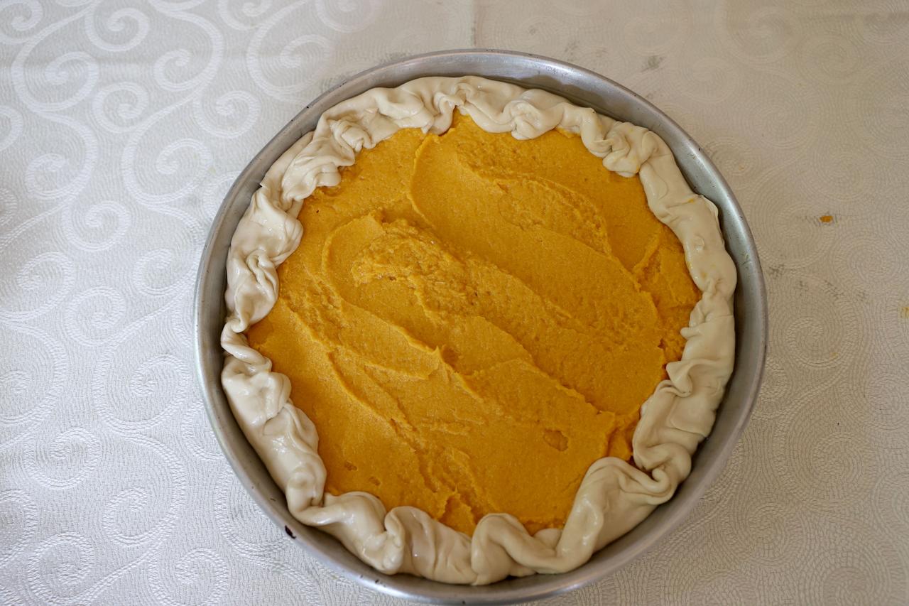 Unbaked tikvenik pastry filled with winter squash puree is prepared before being placed in the oven in Kirklareli, Türkiye, Feb. 25, 2026. (AA Photo)