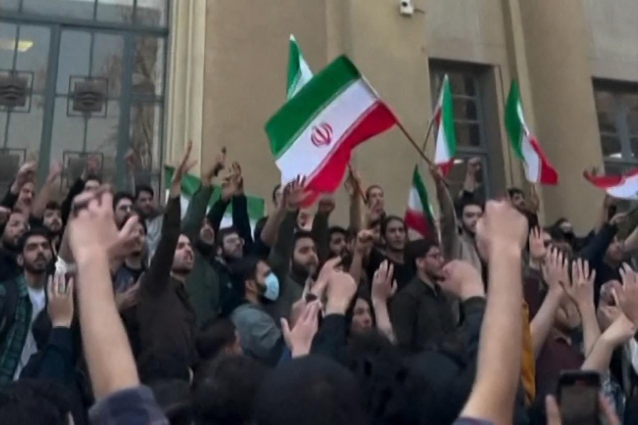 This video grab taken on February 23, 2026, from UGC images posted on social media on February 22, 2026, and verified by AFPTV teams in Paris, shows students staging a rally in support of the Iranian government on the campus of Sharif University in Tehran. (AFP Photo)