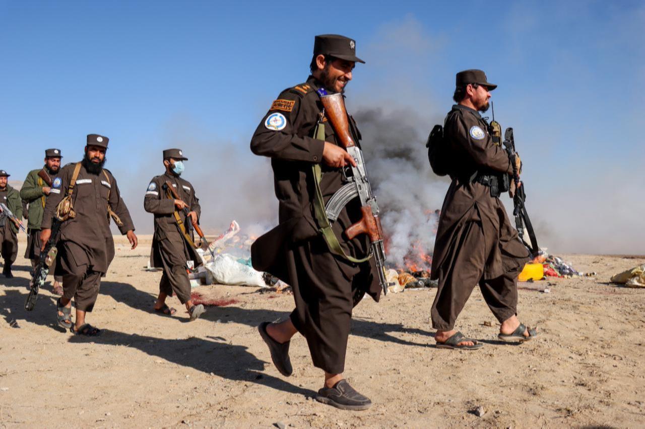 Taliban security personnel depart after setting fire to confiscated narcotics on the outskirts of Herat province, Nov. 6, 2025. (AFP Photo)