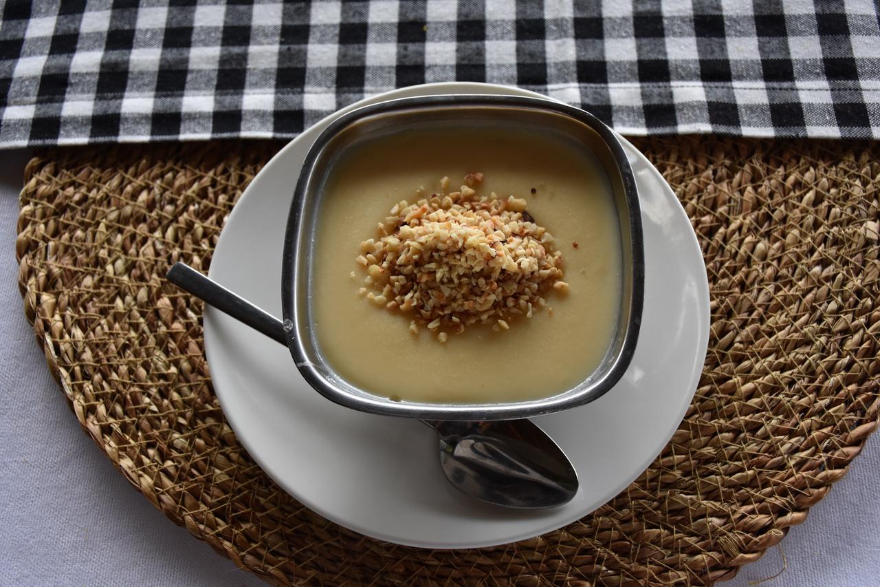 Hamsikoy sutlac is served with crushed hazelnuts, a common topping for the traditional dessert in Trabzon, Türkiye, Feb. 26, 2026. (AA Photo)