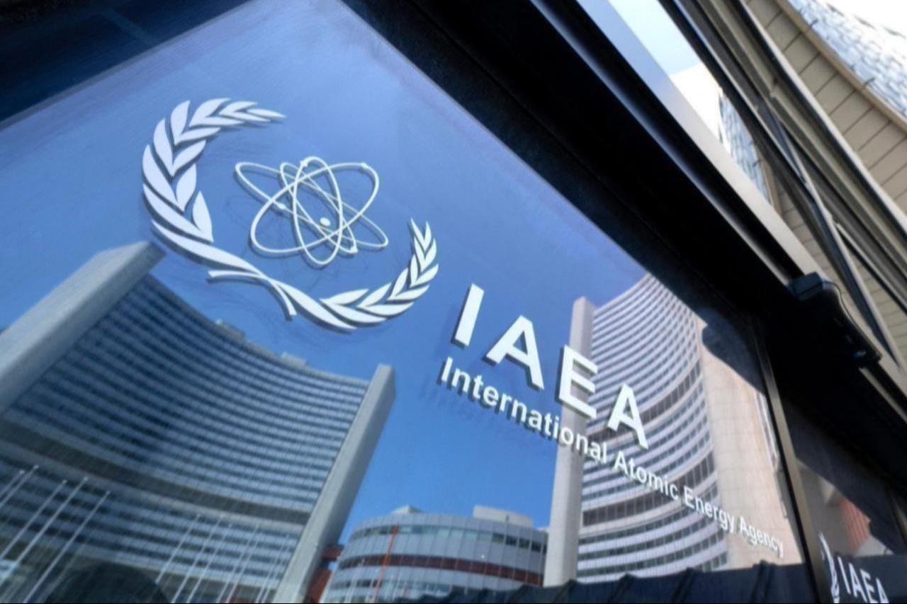Buildings of the International Atomic Energy Agency headquarters reflect in doors with the agencys logo during the IAEA’s Board of Governors meeting in Vienna, Austria on June 13, 2025. (AFP Photo)