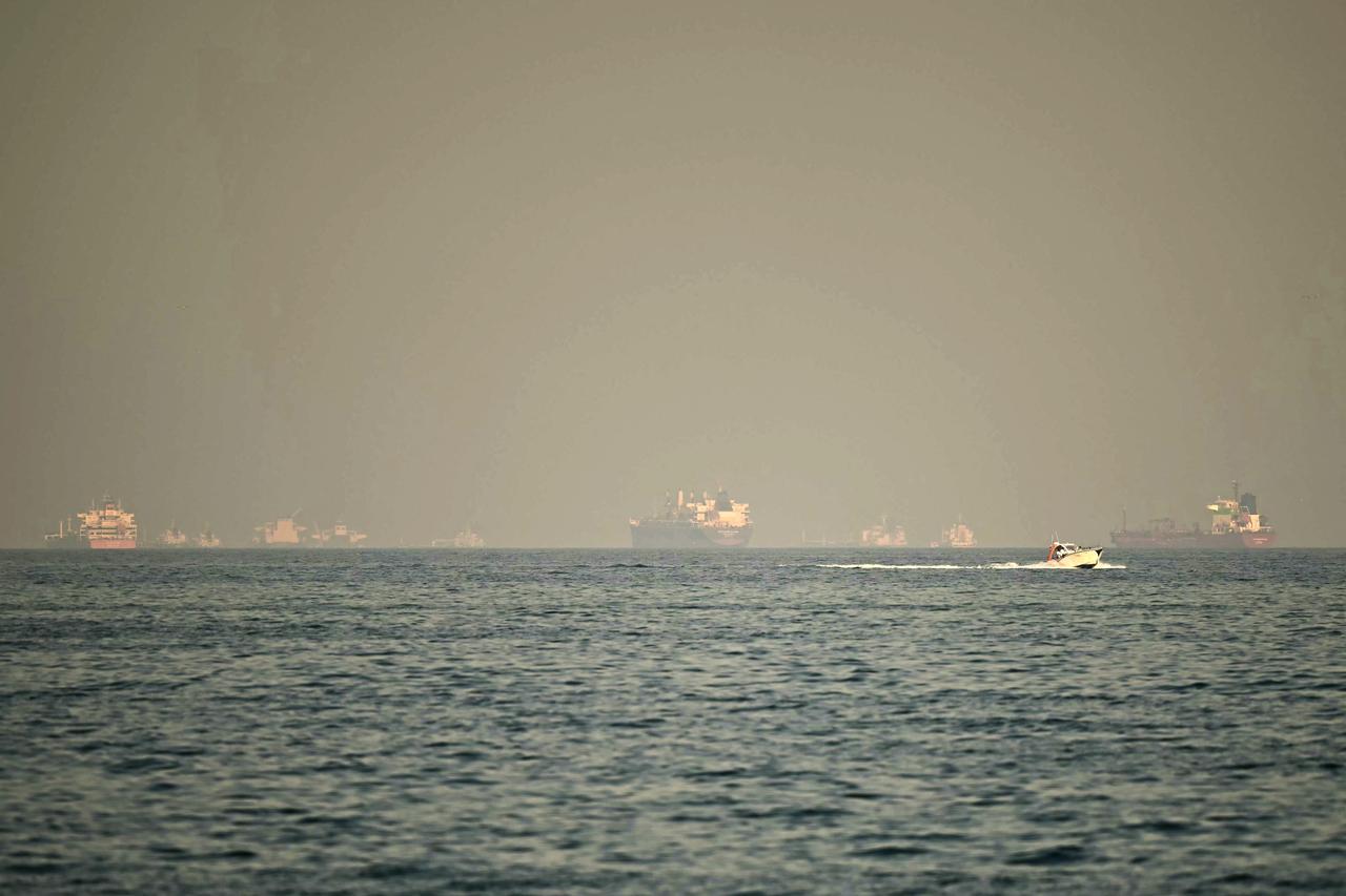 Cargo ships and tankers are seen off coast city of Fujairah, in the Strait of Hormuz in the northern Emirate, February 25, 2026. (AFP Photo)