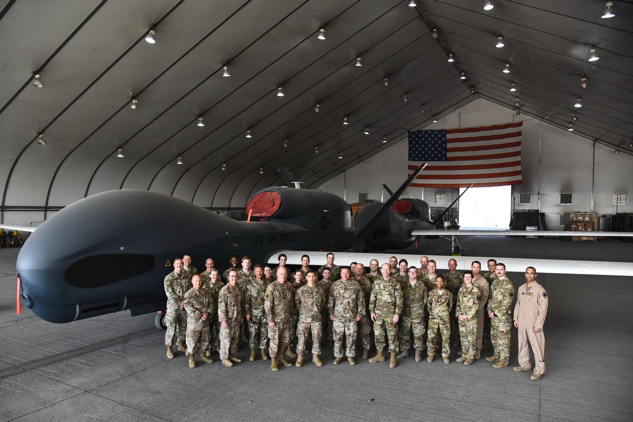 US Air Force officials pose for a group photo with Airmen assigned to the 380th Expeditionary Maintenance Group and 380th Expeditionary Operations Group at Al Dhafra Air Base, United Arab Emirates, Feb. 14, 2019. (Phoot via US Air Force)