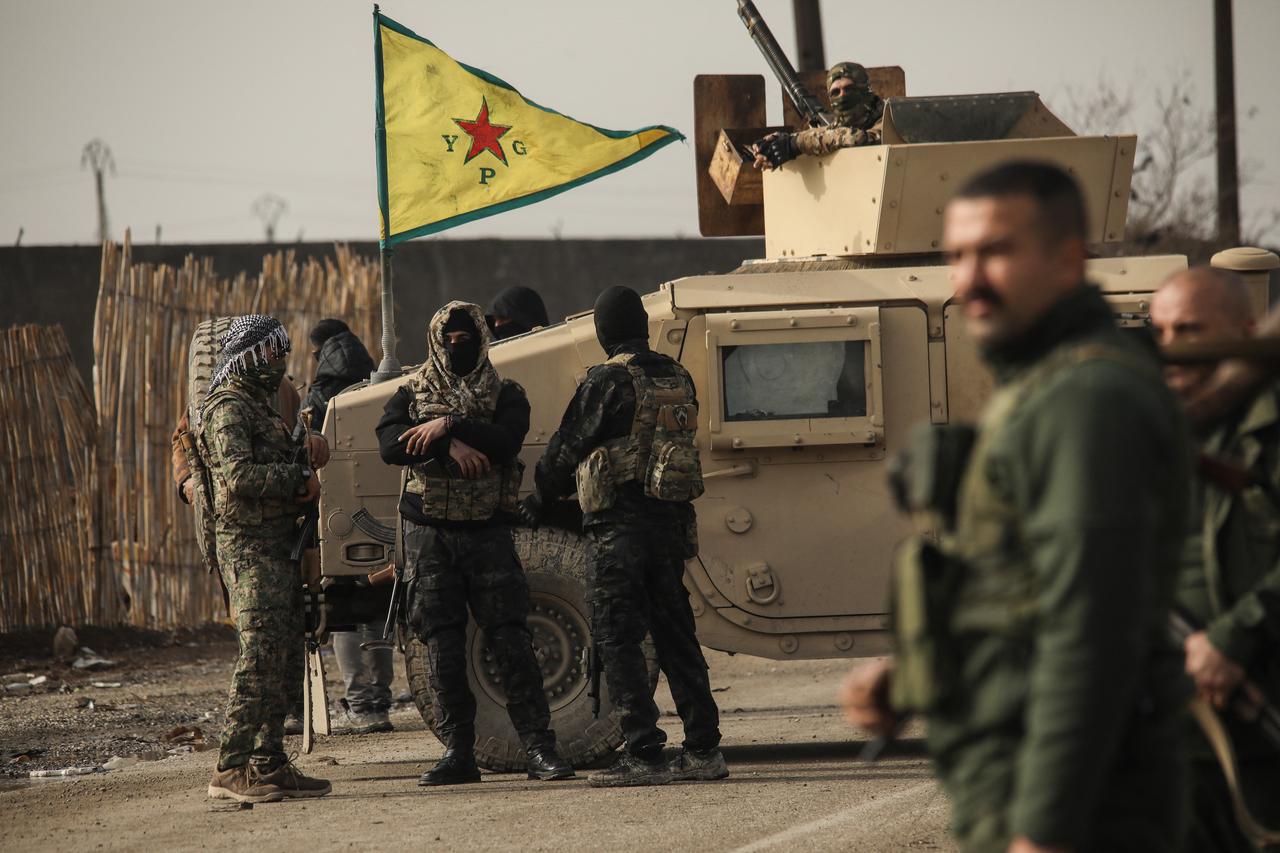 Terrorist organization YPG/SDF members stand guard as Syrian government internal security forces enter the northeastern Syrian city of Hasakah, Feb. 2, 2026. (AFP Photo)