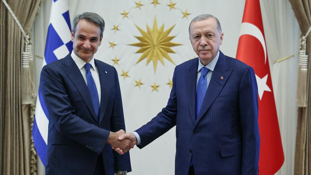 Greek Prime Minister Kyriakos Mitsotakis (L) and President Recep Tayyip Erdogan posing before a meeting in Ankara, May 13, 2024. (Photo via Turkish Presidental Press Service/AFP)