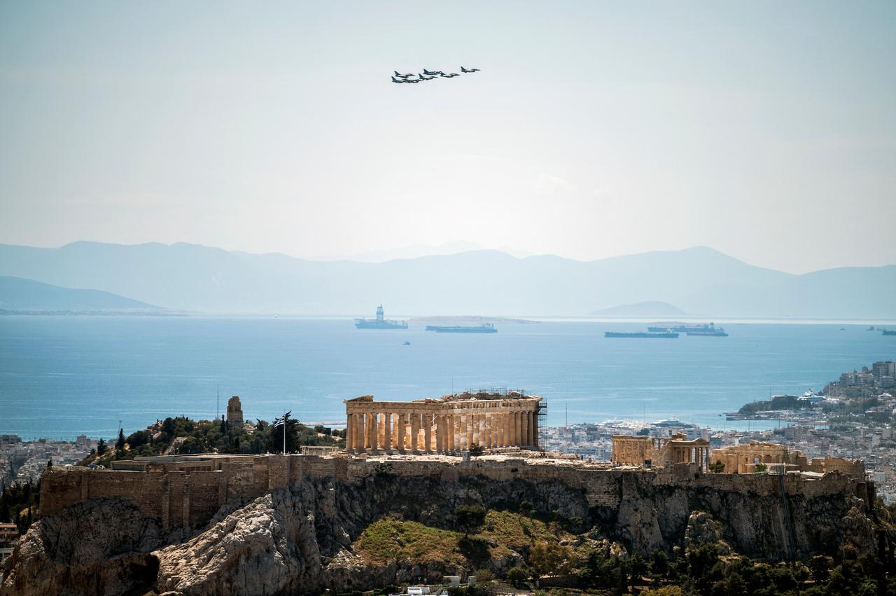 Fighter jets fly over the Acropolis hill during the international military exercise "Iniochos 2021"  in Athens, Greece, on April 22, 2021. (AFP Photo)