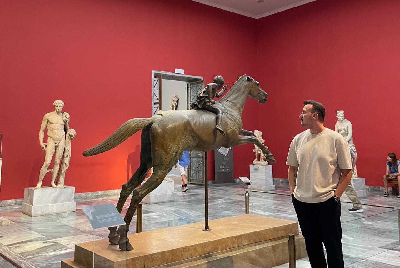 Editor Koray Erdogan looks at "the Artemision Jockey" bronze sculpture inside the National Archaeological Museum in Athens, Greece, July 24, 2025. (Photo by Türkiye Today team)