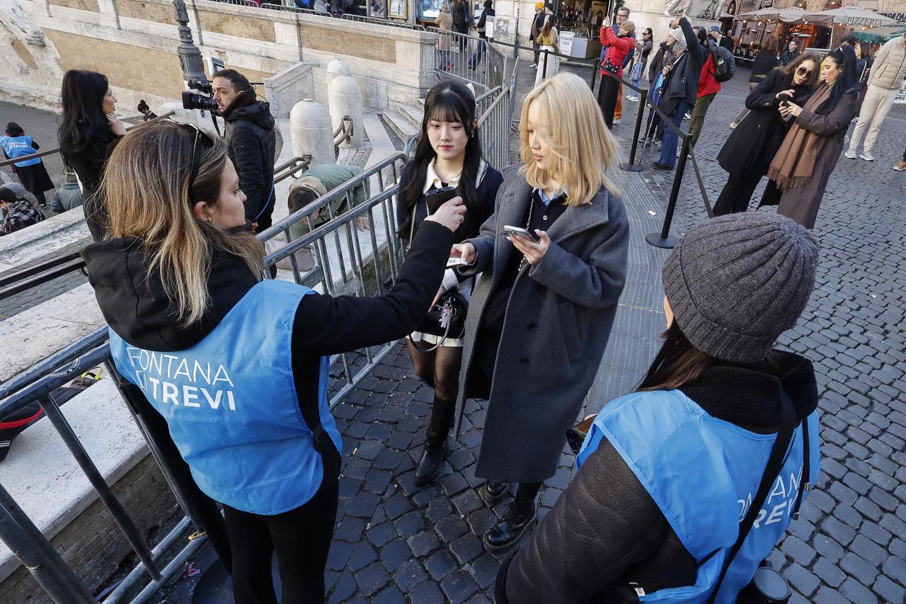 Stewards check the entry tickets of tourists entering the Trevi Fountain in Rome, Italy, Feb. 2, 2026. (AA Photo)