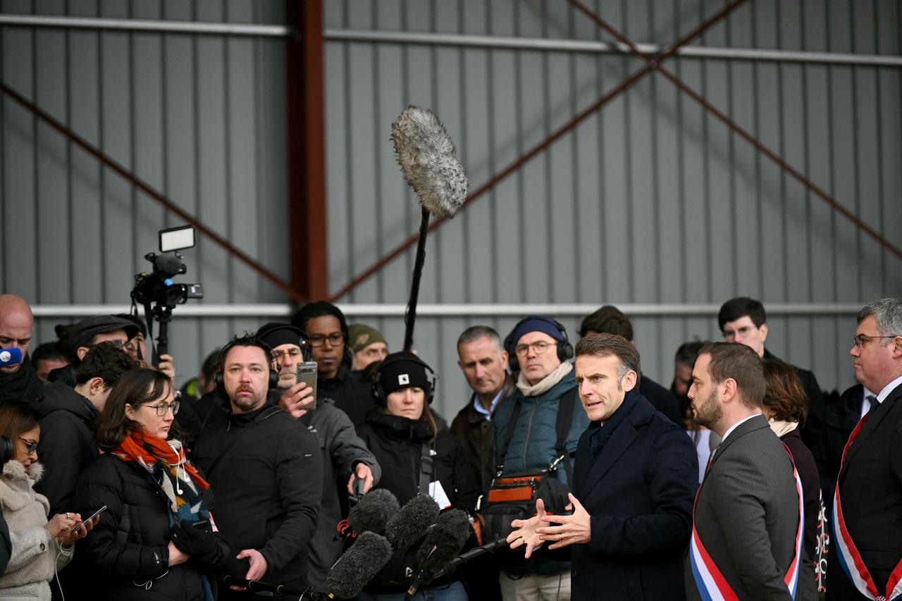 France's President Emmanuel Macron (3rd R) speaks to the press next to local MPs for French far-right party Rassemblement National Emeric Salmon (R) and Antoine Villedieu (2nd R)  after a meeting with representatives of local farmers unions during a visit at the Py brothers farm in Vallerois-le-Bois, eastern France, on February 3, 2026. (AFP Photo)