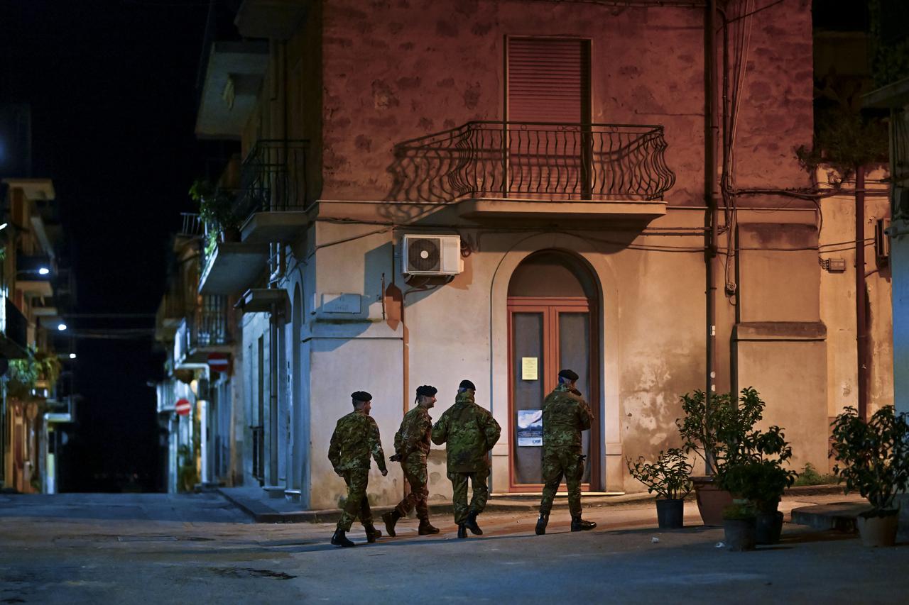 People try to recover their object and most dear memories from their home in Niscemi, Sicily, Italy, Feb. 3, 2026. (AA Photo)