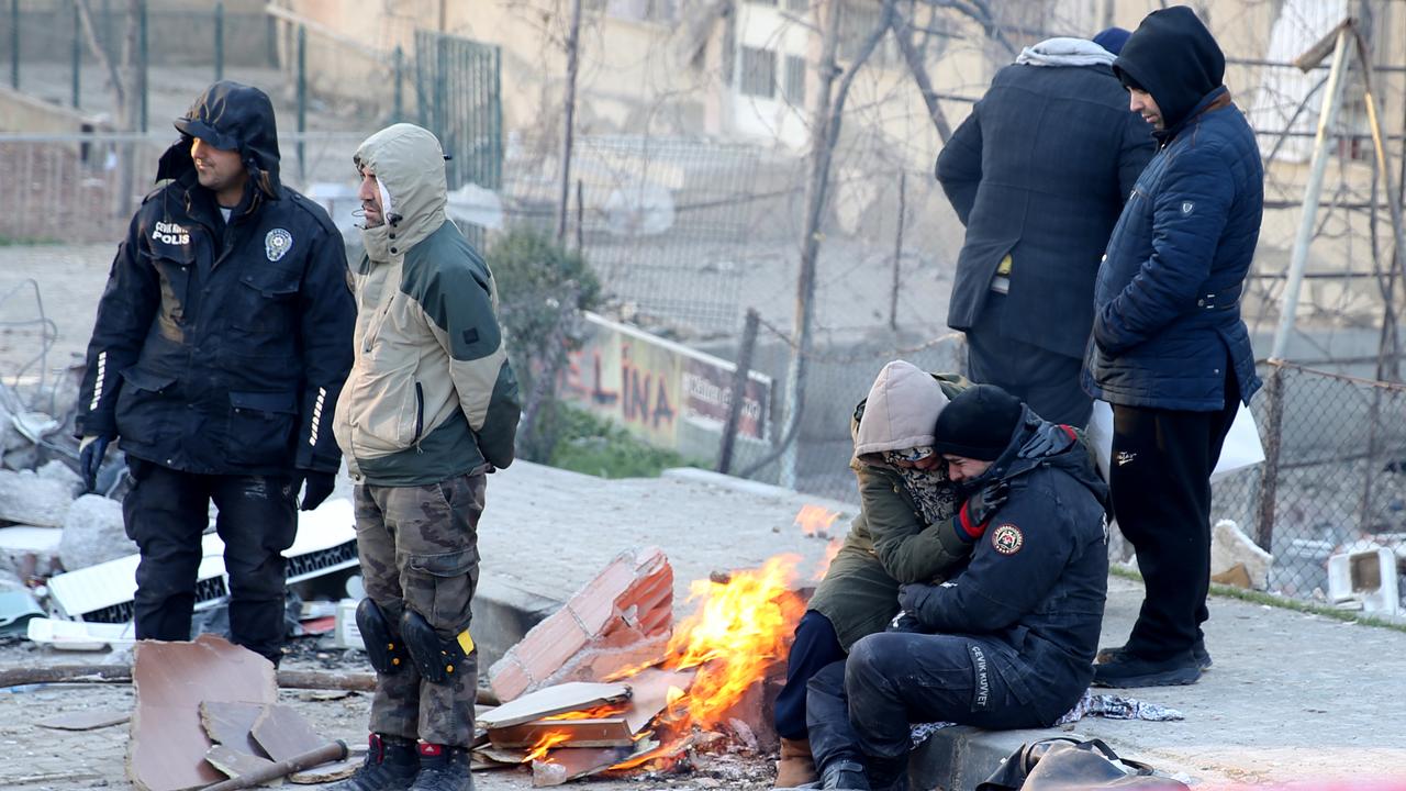 A police officer whose relatives are under the rubble watch the search and rescue efforts with tears, Kahramanmaras, Turkiye, February 8, 2023. (AA Photo)
