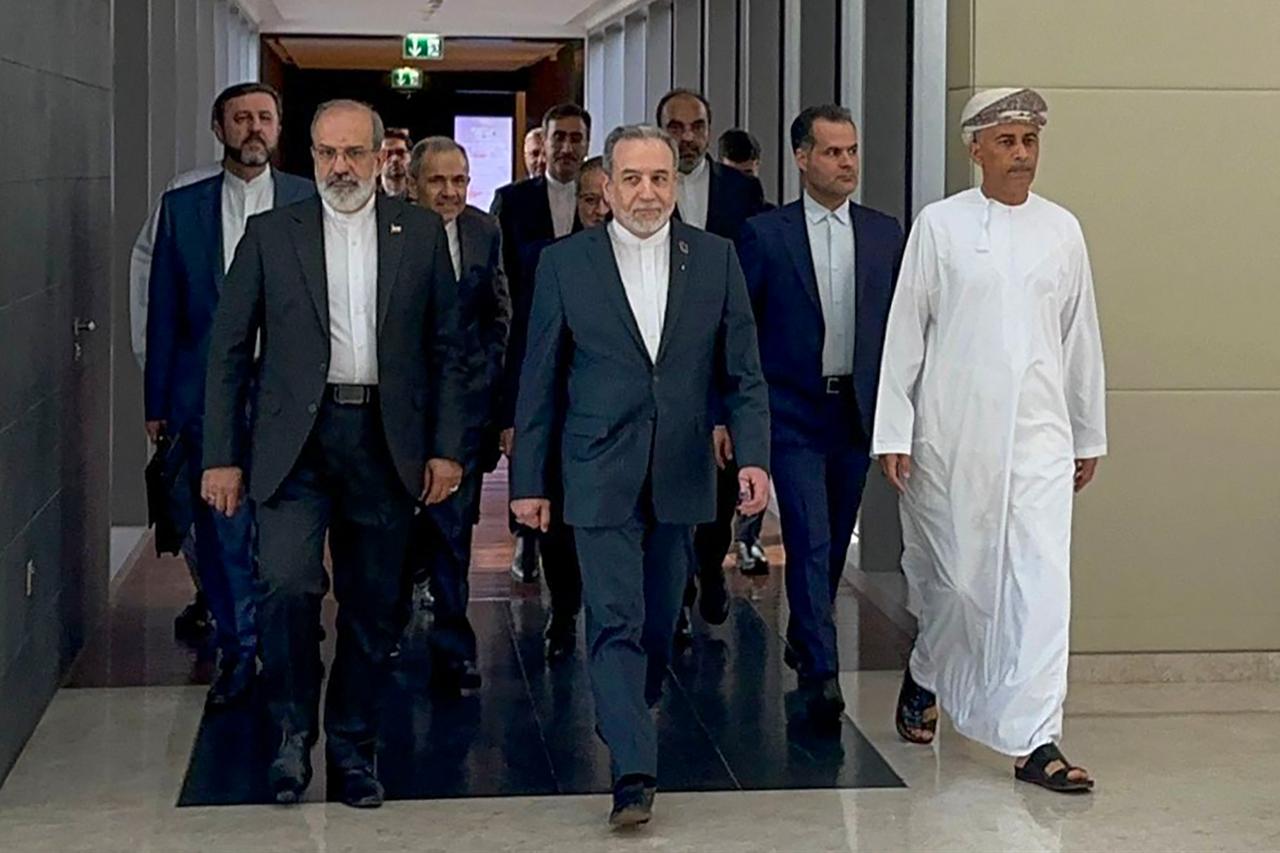 Iran’s Foreign Minister Abbas Araghchi (C) arrives for a meeting in Muscat, Oman on Feb. 6, 2026" (Photo by IRAN FOREIGN MINISTRY / AFP)
