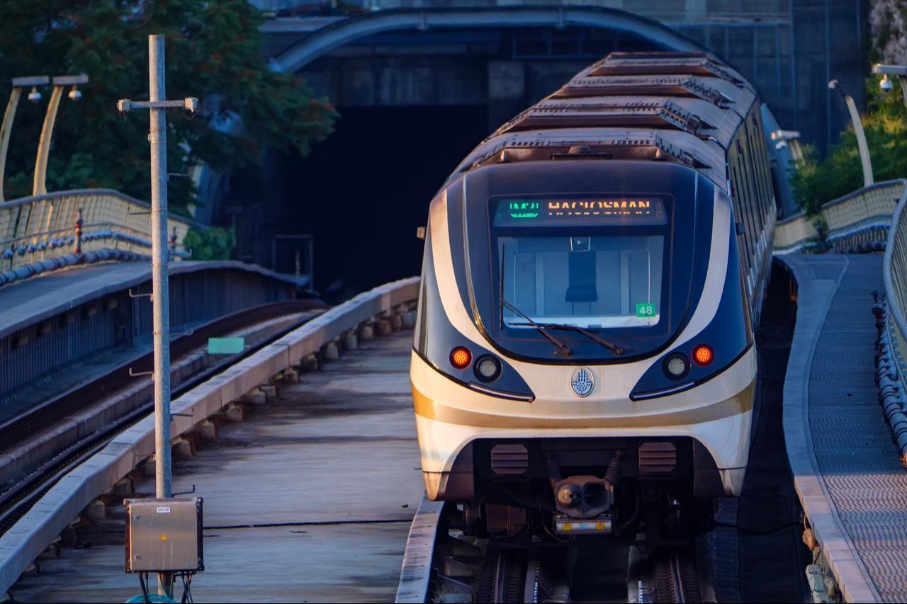 A metro train emerges from the tunnel onto the Golden Horn Metro Bridge in Istanbul, Türkiye, date and time undisclosed. (Adobe Stock Photo)