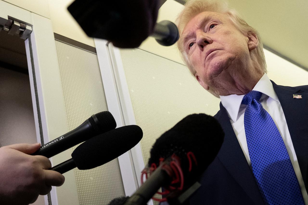 US President Donald Trump speaks with reporters aboard Air Force One on his way to Palm Beach International Airport on February 6, 2026. (AFP Photo)