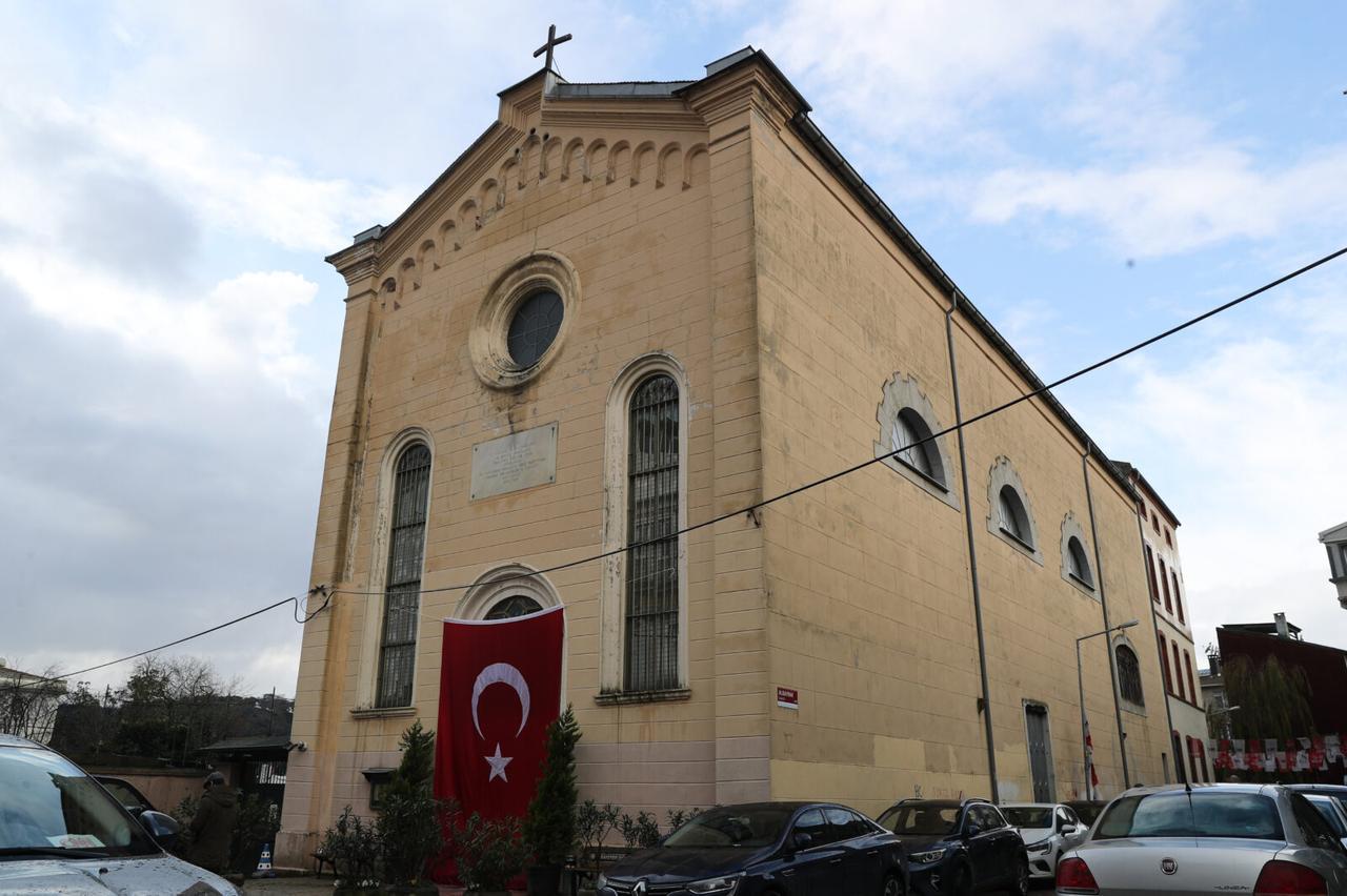 A large Turkish flag was hung on the main door of the Santa Maria Church after the attack in Istanbul, Türkiye. (AA Photo)