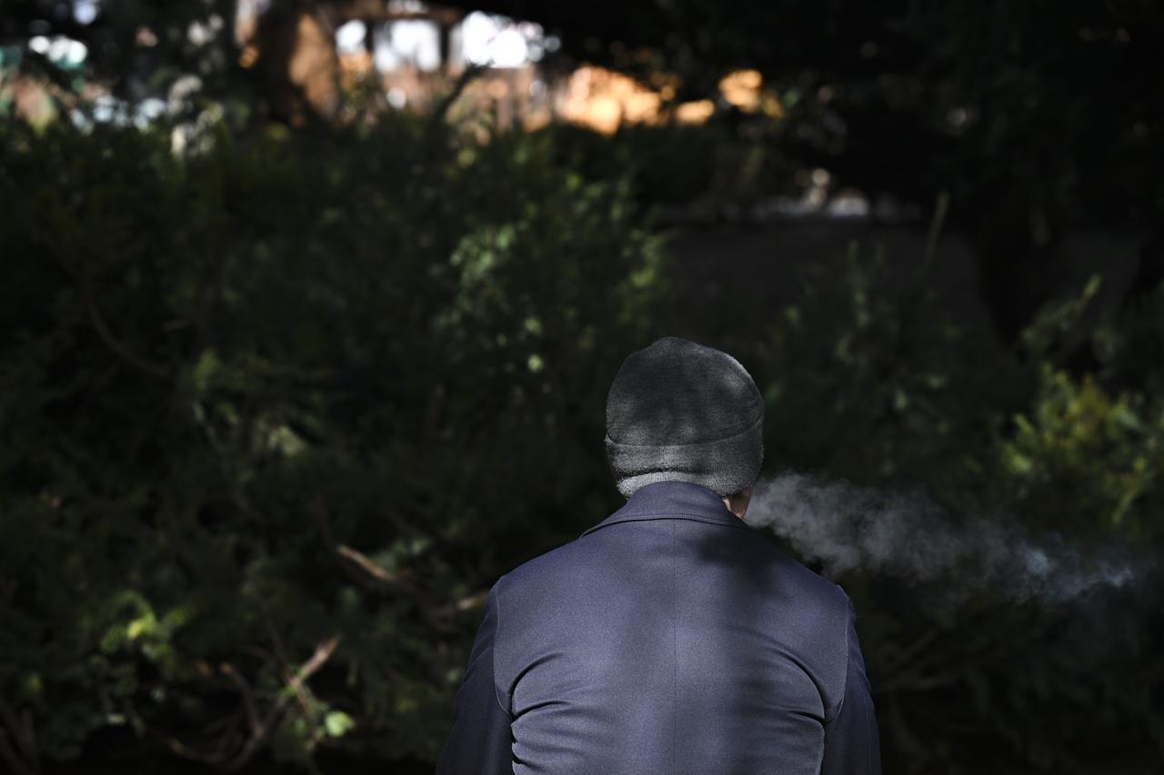 A person smokes a cigarette outdoors. Ankara, Türkiye, February 7, 2026. (AA Photo)