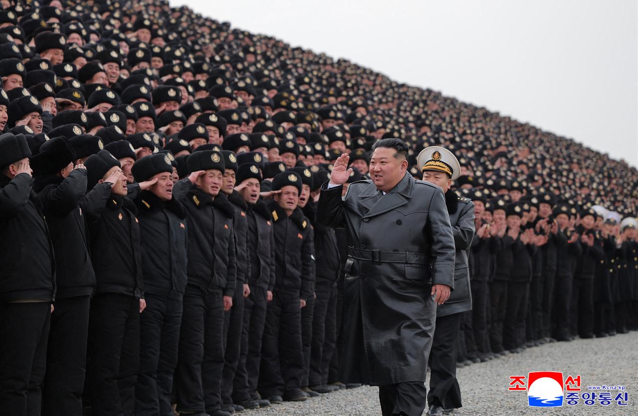 North Korean leader Kim Jong Un participating in a commemorative photo session with soldiers who were involved in the construction of the Sinuiju Combined Greenhouse Farm in North Pyongan Province, North Korea on February 1, 2026. (KCNA/AFP Photo)