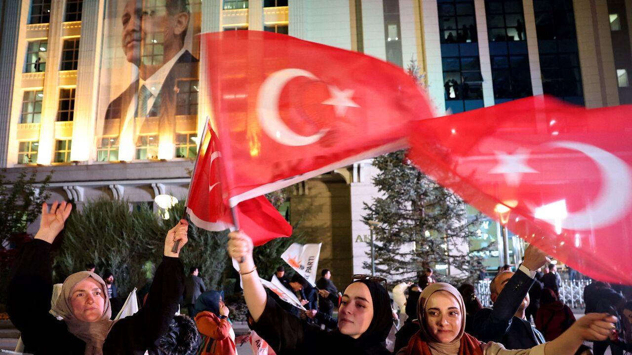 Supporters of Turkish President Recep Tayyip Erdogan and AK Party wave flags at the AK Party headquarters in Ankara, Türkiye, May 14, 2023. (AFP Photo)