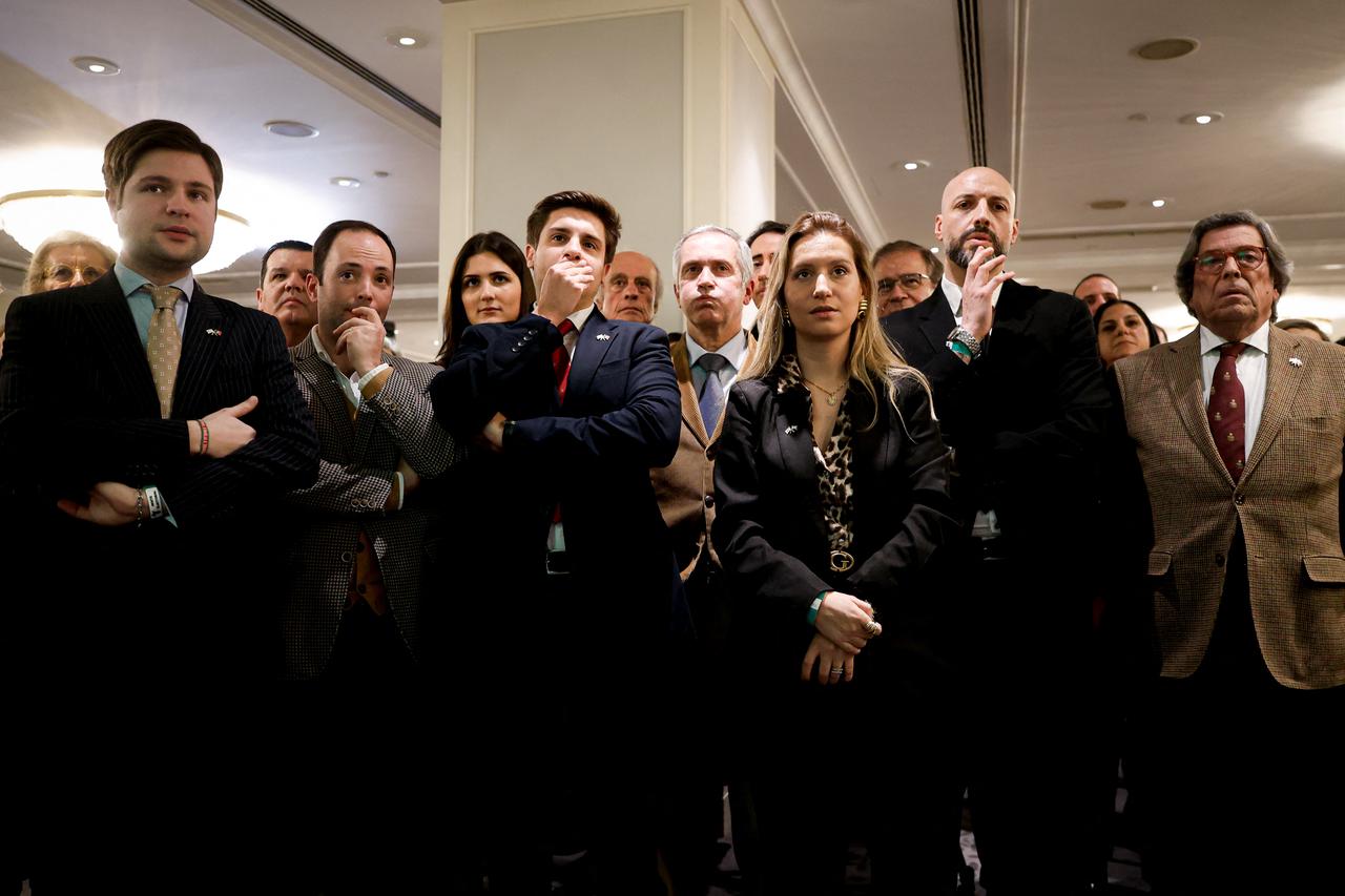 Supporters of far-right candidate Andre Ventura (not pictured), leader of Chega party, react to the exit poll results on the night of Portugal's presidential election second round in Lisbon on Feb. 8, 2026. (AFP Photo)