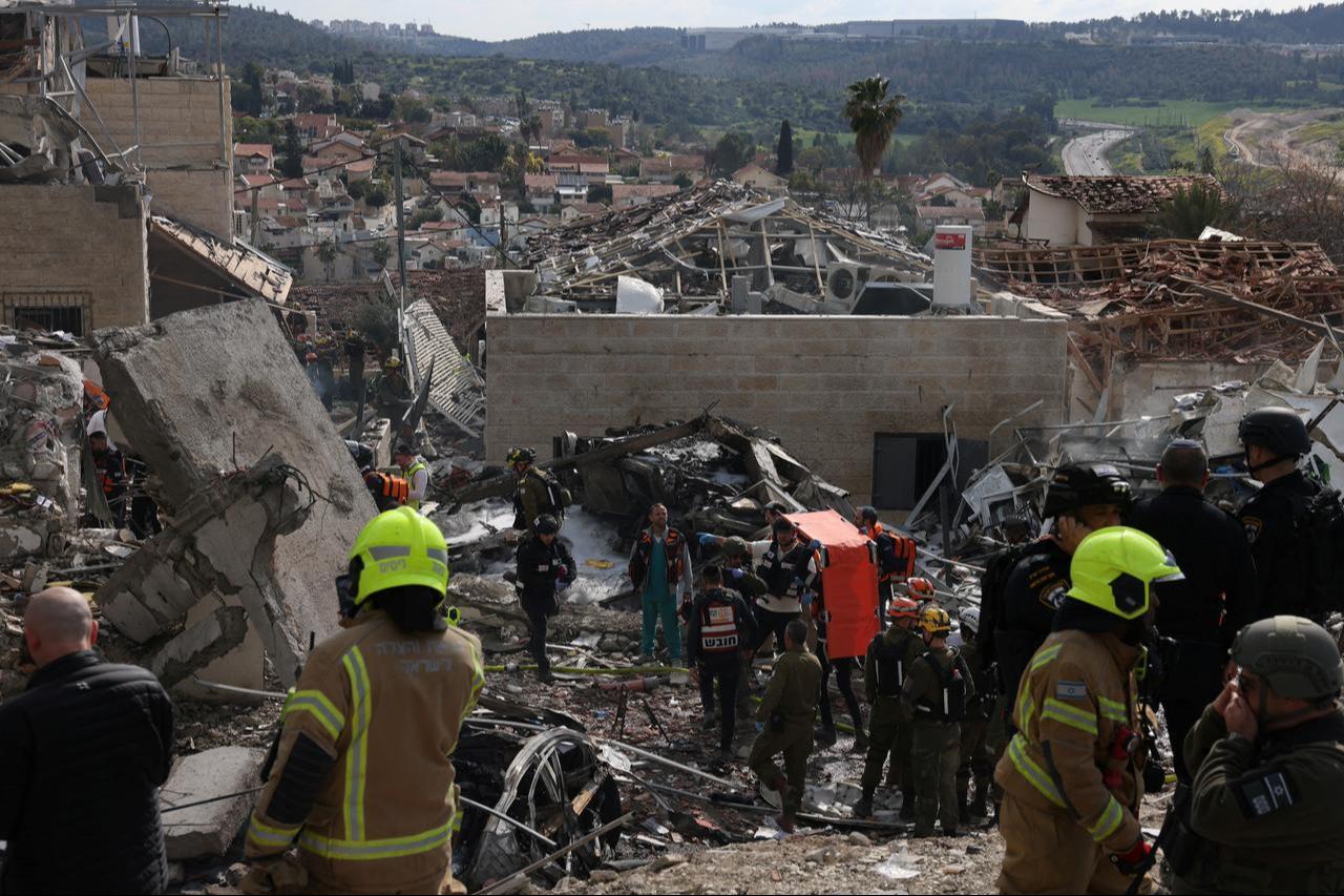 Israeli emergency services secure the scene of a missile attack near Bet Shemesh, some 30 kilometres west of Jerusalem, on March 1, 2026. (AFP Photo)