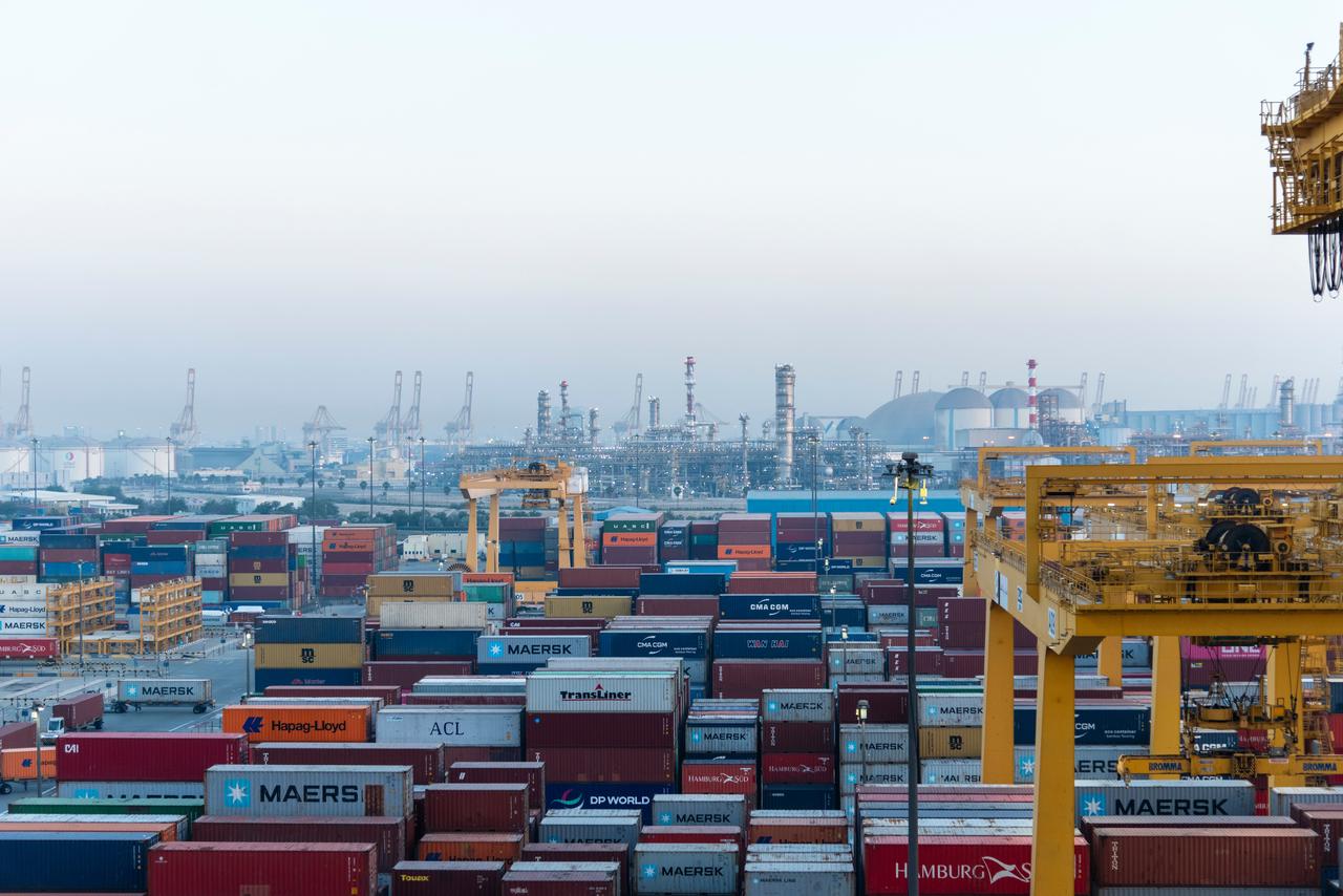 Shipping containers are stacked at Jebel Ali Port in Dubai, United Arab Emirates. (Adobe Stock Photo)