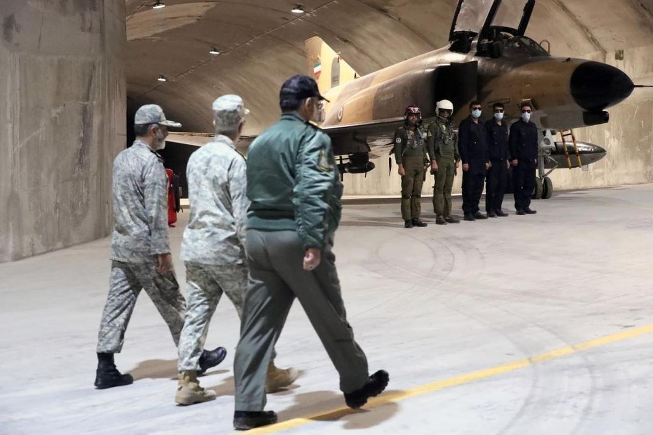Iranian Armed Forces Chief of Staff and Iran's Army chief, and military officials visit the first underground air force base, called "Eagle 44," in Iran on February 7, 2023. (Photo via Iranian Army/Handout)